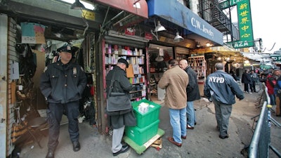 New York police sized over $1 million in counterfeit Gucci, Prada, Fendi, Rolex and Coach goods in a Chinatown raid in 2008.