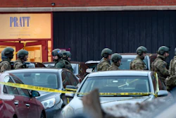 Law enforcement officers gather outside the Henry Pratt Co. manufacturing plant Friday, Feb. 15, 2019, in Aurora, Ill. A gunman killed several people and injured police officers before he was fatally shot.