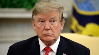 President Donald Trump listens as he meets with NATO Secretary General Jens Stoltenberg in the Oval Office of the White House, Tuesday, April 2, 2019, in Washington.