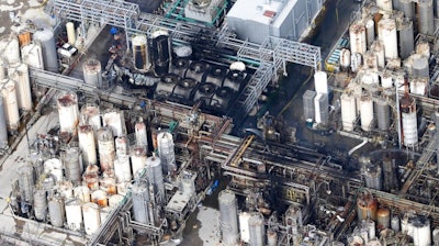 This aerial photo shows the KMCO chemical plant as firefighters spray water on a fire on Tuesday, April 2, 2019, in Crosby, Texas. Pilar Davis, a product manager with KMCO, says the fire initially ignited with isobutylene and was fueled by ethanol and ethyl acrylate. All three are chemicals and solvents used to make fuel additives at the plant.