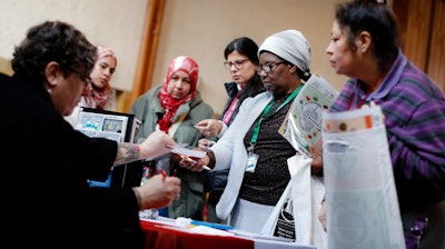 Visitors get specialized immigration assistance at Welcome Dayton’s special events like this Women’s Day celebration in 2017.