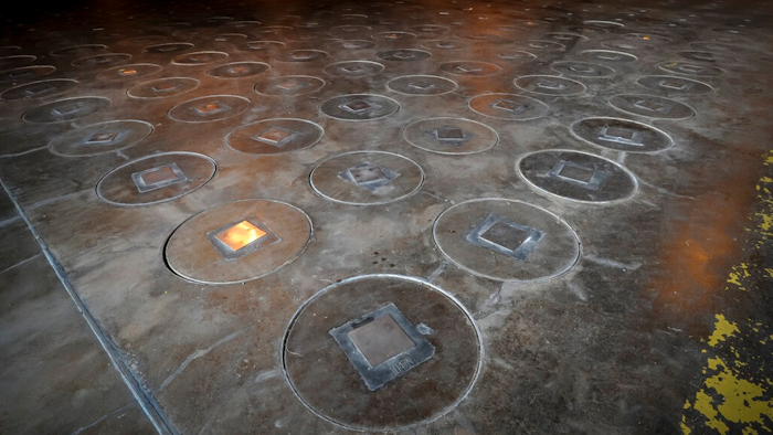 In this Nov. 20, 2013 file photo, radioactive waste, sealed in large stainless steel canisters, is stored under five feet of concrete in a storage building at the Savannah River Site near Aiken, S.C. U.S. Energy Secretary Rick Perry is pledging to expedite the removal of weapons-grade plutonium his agency secretly shipped to Nevada last year, beginning in 2021. Perry said in an April 24, 2019 letter to Nevada Sen. Catherine Cortez Masto, made public on Tuesday, April 30, that DOE intends to complete the removal of one-half metric ton (1,102 pounds) of the highly radioactive material from Nevada by the end of 2026.