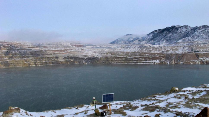 This Dec. 14, 2016 file photo shows Berkeley Pit in Butte. Atlantic Richfield wants to build a second treatment plant to lower the level of acidic, metal-laden water that has collected in a former mining pit in Butte that was closed more than 35 years ago, The Montana Standard reported Wednesday, May 29, 2019.