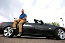 In this April 23, 2019, photo, Chris Williamson poses for a photo sitting on his car in Phoenix. When Williamson was in the market for a new family car, a timely ad and conversations with a co-worker convinced him to try something out of the ordinary. He bought the BMW 3 Series convertible and covers the payments by renting it to strangers on a peer-to-peer car sharing app called Turo. It allows his family of seven to have a nicer car, essentially for free.