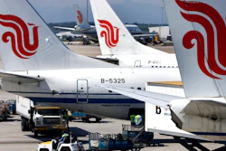In this Aug. 29, 2007, file photo, Air China passenger airliners park at the Beijing International Airport in Beijing, China. Air China Ltd., one of China's three major state-owned airlines, is joining carriers that are asking Boeing Co. for compensation for the grounding of their 737 Max jetliners following two fatal crashes.