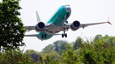 In this May 8, 2019, file photo, a Boeing 737 MAX 8 jetliner being built for Turkish Airlines takes off on a test flight in Renton, Wash. Representatives from more 30 countries met with Federal Aviation Administration officials Thursday, May 23, to hear the U.S. regulator's approach to determining how soon the Boeing 737 Max can resume flying after two crashes that killed 346 people.