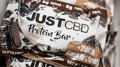 A cookies and cream flavored protein bar marketed by JustCBD is displayed at the Cannabis World Congress & Business Exposition trade show.