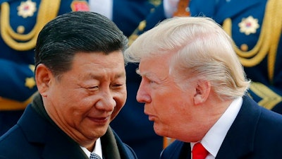 In this Nov. 9, 2017, file photo, U.S. President Donald Trump, right, chats with Chinese President Xi Jinping during a welcome ceremony at the Great Hall of the People in Beijing. Tensions between the world’s two biggest economies intensified over the last week. The Trump administration more than doubled tariffs on $200 billion in Chinese imports and spelled out plans to target the $300 billion worth that aren’t already facing 25% taxes. The Chinese have punched back by upping tariffs on $60 billion in U.S. imports.