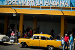 In this Sept. 1, 2014 file photo, people put their luggage in a private taxi as they arrive from the U.S. to the Jose Marti International Airport in Havana, Cuba. In 1958, the father of José Ramón López owned Cuba's main airport, its national airline and three small hotels. All were taken in Cuba's socialist revolution. Starting Thursday, they will be able to file lawsuits against European and American companies doing business on their former properties, thanks to the Trump administration's decision to activate a provision of the U.S. embargo on Cuba with the potential to affect foreign investment in Cuba for many years to come.