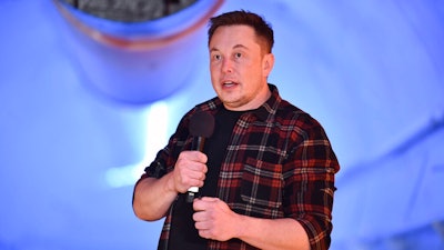 In this Tuesday, Dec. 18, 2018 file photo, Elon Musk, co-founder and chief executive officer of Tesla Inc., speaks during an unveiling event for the Boring Co. Musk will have to go to trial to defend himself for mocking a British diver as a pedophile in a verbal sparring match that unfolded last summer after the underwater rescue of youth soccer players trapped in a Thailand cave. A federal court judge in Los Angeles set an Oct. 22, 2019, trial date in a Friday, May 10, court filing that rejected Musk's attempt to dismiss a defamation lawsuit filed by British diver Vernon Unsworth.