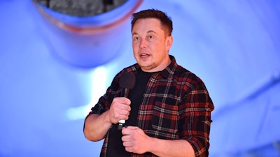 In this Tuesday, Dec. 18, 2018 file photo, Elon Musk, co-founder and chief executive officer of Tesla Inc., speaks during an unveiling event for the Boring Co. Musk will have to go to trial to defend himself for mocking a British diver as a pedophile in a verbal sparring match that unfolded last summer after the underwater rescue of youth soccer players trapped in a Thailand cave. A federal court judge in Los Angeles set an Oct. 22, 2019, trial date in a Friday, May 10, court filing that rejected Musk's attempt to dismiss a defamation lawsuit filed by British diver Vernon Unsworth.