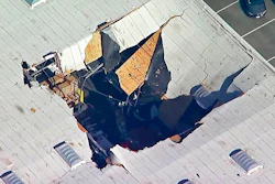 This photo taken from video provided by KABC-TV shows where an F-16 fighter jet crashed into a warehouse just outside March Air Reserve Base in Riverside, Calif., Thursday afternoon, May 16, 2019. Maj. Perry Covington, director of public affairs at the base, says the pilot ejected before the crash and was not hurt and there are no immediate reports of injuries on the ground.