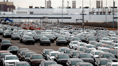 In this Feb. 26, 2019 file photo, Jeep vehicles are parked outside the Jefferson North Assembly Plant in Detroit. Land deals that will allow Fiat Chrysler to build a new assembly plant in Detroit are expected to cost the city and state about $107 million. Mayor Mike Duggan released details Friday of agreements reached for nearly 215 acres on the city's east side that the automaker wants as part of a $1.6 billion investment.