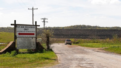 This April 8, 2019, photo, shows a coal-waste dump site in Bokoshe, Okla. Residents of Bokoshe have been worried for years about coal-ash contamination. Now the Environmental Protection Agency has approved Oklahoma to be the first state to take over enforcement on coal-ash sites.
