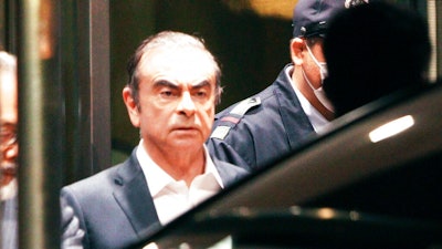 In this April 25, 2019, former Nissan Chairman Carlos Ghosn leaves the Tokyo Detention Center in Tokyo. A Japanese court has turned down an appeal from the lawyers of Ghosn over his bail conditions that limit his contact with his wife. Kyodo News service reported Thursday the Tokyo District Court rejected the appeal filed earlier in the day.