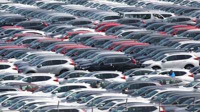 In this March 5, 2019, photo, Honda Motor Co. cars for export are parked at a port in Yokohama, near Tokyo. When U.S. President Donald Trump visits Japan, he’ll be able to point to Tokyo’s streets to drive home a sore point in trade relations between the allies: the absence of made-in-USA vehicles. While Trump complained repeatedly about the trade imbalance, especially in autos and auto parts - the Hondas and Toyotas on U.S. roads are a daily reminder.