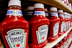 This Feb. 21, 2018, file photo shows a display of Heinz Ketchup in a market in Pittsburgh. Kraft Heinz is restating financial results for 2016, 2017 and the first nine months of 2018. The company has been conducting an internal investigation after the SEC launched a probe into its procurement operations. Kraft Heinz says its investigation is ‘substantially complete.’
