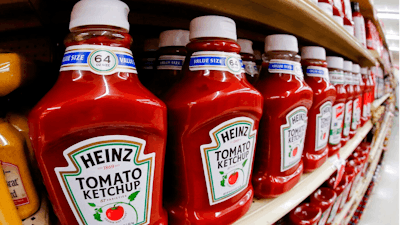 This Feb. 21, 2018, file photo shows a display of Heinz Ketchup in a market in Pittsburgh. Kraft Heinz is restating financial results for 2016, 2017 and the first nine months of 2018. The company has been conducting an internal investigation after the SEC launched a probe into its procurement operations. Kraft Heinz says its investigation is ‘substantially complete.’