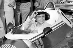 In this Sept. 7, 1976 file photo Austria's Niki Lauda behind the wheel of his Ferrari 312 T2 on the track of Florano after a near fatal crash on Aug. 1 during the German Grand Prix. Three-time Formula One world champion Niki Lauda, who won two of his titles after a horrific crash that left him with serious burns and went on to become a prominent figure in the aviation industry, has died. He was 70.