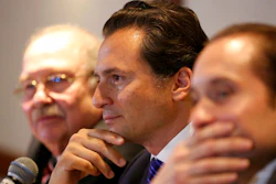 In this Aug. 17, 2017 file photo, flanked by lawyer Javier Coello Trejo, left, Emilio Lozoya, former head of Mexico's state-owned oil company Pemex, attends a press conference, in Mexico City. The head of Mexico’s financial intelligence unit says that the former Pemex executive who was sanctioned Wednesday, May 22, 2019, by the comptroller’s office is Lozoya.