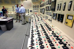 Senior Reactor Operator Christina Renaud, left, speaks with Training Supervisor Paul Gresh, center, and Control Room Supervisor Bob Sheridan, right, in the Control Room Simulator moments before a simulated reactor shutdown, Tuesday, May 28, 2019, at a training facility several miles from the Pilgrim Nuclear Power Station, in Plymouth, Mass. The simulated shutdown was performed in front of members of the media Tuesday ahead of the planned actual shutdown of the aging reactor on Friday, May 31.
