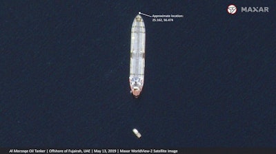 This satellite image provided by Maxar Technologies shows the Saudi-flagged oil tanker Al Marzoqa off the coast of Fujairah, United Arab Emirates, Monday, May 13, 2019. As many as four oil tankers anchored in the Mideast were damaged in what Gulf officials described Monday as a 'sabotage' attack off the coast of the United Arab Emirates.