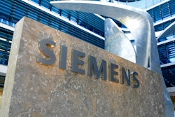 This June 24, 2016 file photo shows the logo of German industrial conglomerate Siemens at the new headquarters in Munich, Germany. German industrial equipment maker Siemens said Tuesday May 7, 2019, it will cut some 10,000 jobs in a major restructuring that will involve spinning off its oil, gas and power generation business and creating new areas of growth.