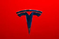 This Wednesday, Aug. 8, 2018, file photo shows the Tesla emblem on the back end of a Model S in the Tesla showroom in Santa Monica, Calif. Faced with a slumping stock price and questions about demand for its vehicles, Tesla has lowered the U.S. base prices of its two most expensive models. The company on Monday, May 21, 2019 cut $3,000 from the price of the Model S sedan and $2,000 from the Model X SUV.