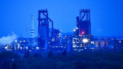 The furnace of German steelmaker Thyssenkrupp is illuminated in the evening twilight in Duisburg, Germany, Thursday, May 9, 2019. Steelmaking giant Thyssenkrupp of Germany says it expects European antitrust regulators to block its plan to combine its European operations with India's Tata Steel.