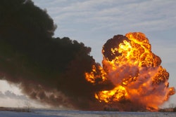 In this Dec. 30, 2013 file photo, a fireball goes up at the site of an oil train derailment near Casselton, N.D. The Trump administration is withdrawing a proposal for freight trains to have at least two crew members that was drafted in response to explosions of crude oil trains in the U.S. and Canada. Transportation officials said Thursday, May 23, 2019 that a review of accident data did not support the notion that having one crew member is less safe than a multi-person crew.