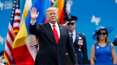 President Donald Trump waves as he takes the stage to speak at the U.S. Air Force Academy graduation Thursday, May 30, 2019 at Air Force Academy, Colo.