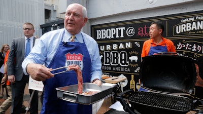 U.S. Secretary of Agriculture Sonny Perdue prepares to barbecue U.S. beef in Tokyo to highlight his message: Japan must treat the U.S. fairly as a top customer for Japanese products.