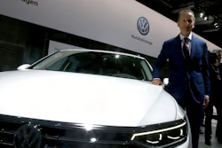 Herbert Diess, CEO of the Volkswagen stock company, poses next to a Volkswagen car prior to the company's annual general meeting in Berlin, Germany, Tuesday, May 14, 2019.