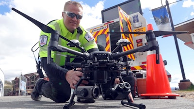 Travis White, Utah Department of Transportation, Highway Incident Management Team, holds their drone at a drone demo Monday, May 20, 2019, in Park City, Utah. In Utah, drones are hovering near avalanches to watch roaring snow. In North Carolina, they're searching for the nests of endangered birds. In Kansas, they could soon be identifying sick cows through heat signatures. Public transportation agencies are using drones in nearly every state, according to a new survey released on Monday, May 20, 2019 by the American Association of State Highway and Transportation Officials.