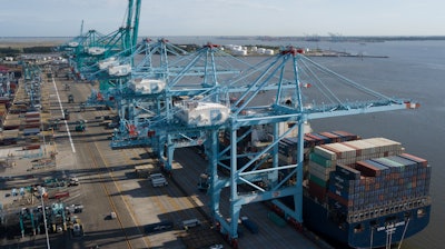 In this May 10, 2019, file photo a container ship is unloaded at the Virginia International Gateway terminal in Norfolk, Va. On Thursday, May 30, the Commerce Department issues the second estimate of how the U.S. economy performed in the January-March quarter.