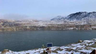 This Dec. 14, 2016 file photo shows Berkeley Pit in Butte. Atlantic Richfield wants to build a second treatment plant to lower the level of acidic, metal-laden water that has collected in a former mining pit in Butte that was closed more than 35 years ago, The Montana Standard reported Wednesday, May 29, 2019.