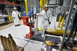 In this Jan. 29, 2015, file photo, ordnance technicians use machines to process inert simulated chemical munitions used for training at the Pueblo Chemical Depot, east of Pueblo, in southern Colorado.