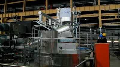 Personnel look up at an experimental salt-based heat storage facility at Berlin's Reuter thermal power station on Wednesday, April 24, 2019. The energy company, together with a Swedish start-up, is testing the use of salt to store heat, which accounts for more than half the power consumed in Germany.