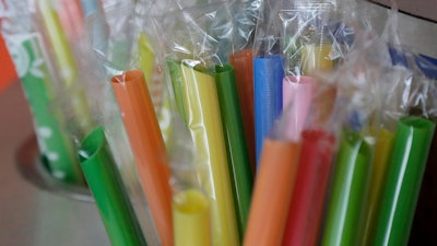 This July 17, 2018 file photo shows wrapped plastic straws at a bubble tea cafe in San Francisco. On Wednesday, the Oregon House or Represenatives voted to prohibit restaurants from providing single-use plastic straws unless a customer asks. Drive-thrus could still offer straws, as could health care facilities. California previously passed limits on plastic straws.