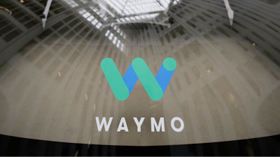 In this Dec. 13, 2016, file photo, a skylight is reflected in the rear window of a Waymo driverless car during a Google event in San Francisco. Google's self-driving vehicle division says it's bringing autonomous trucks to the Phoenix area. Waymo announced Wednesday, May 30, 2019, that its fully self-driving tractor-trailers will start driving on freeways this week and will expand to more routes over time.