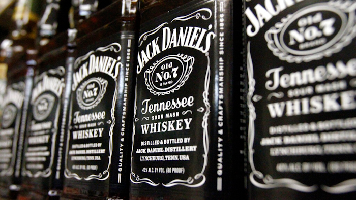 In this Dec. 5, 2011, file photo, bottles of Jack Daniel's Tennessee Whiskey line the shelves of a liquor outlet in Montpelier, Vt. The company that makes Jack Daniels took a hit from the Trump administration’s tariff fight, estimating that the standoff dragged sales growth down by a percentage point for the entire year. Brown-Forman Corp. (BF.A) on Wednesday, June 5, 2019, reported fiscal fourth-quarter net income of $159 million.