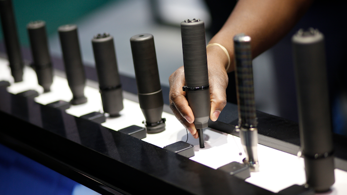 In this file photo, gun silencers are on display at the Sig Sauer booth at the Shooting, Hunting and Outdoor Trade Show in Las Vegas.
