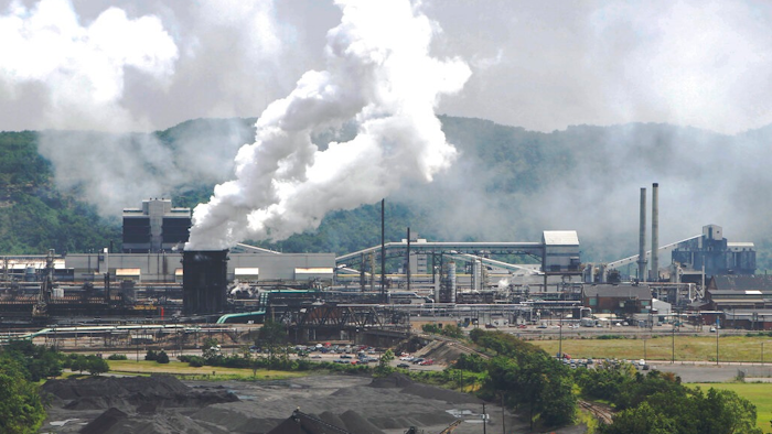 This file photo from July 14, 2010 shows smoke pouring from the United States Steel Corp.'s Clairton Coke Works in Clairton, Pa. A fire at U.S. Steel's massive coke plant outside Pittsburgh knocked a key pollution control system offline Monday, June 17, 2019. It triggered a health warning as officials monitored the air around the plant for signs of a release of toxic sulfur dioxide. It was the second fire since December at the coke works, the largest facility of its kind in the United States. The plant turns coal into coke, one of the raw materials of steel.
