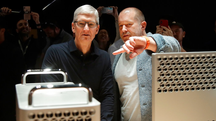 FILE - In this Monday, June 3, 2019 file photo, Apple CEO Tim Cook, left, and chief design officer Jonathan Ive look at the Mac Pro in the display room at the Apple Worldwide Developers Conference in San Jose, Calif. On Thursday, June 27, 2019, Apple said that Ive, chief design officer, will be leaving after more than two decades at the company to start his own firm.