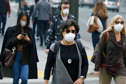 In this Friday, Nov. 9, 2018 file photo, people wear masks while walking through the Financial District in the smoke-filled air in San Francisco, as authorities issued an unhealthy air quality alert for parts of the San Francisco Bay Area as smoke from a massive wildfire drifts south. In 2017 and 2018, the nation had more polluted air days than just a few years earlier, federal data shows. While it remains unclear whether this is the beginning of a trend, health experts say it’s a troubling development.