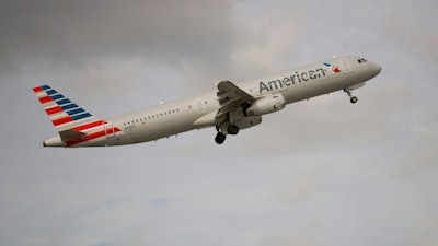 n this Thursday, Nov. 29, 2018, photo, an American Airlines Airbus A321 takes off from Fort Lauderdale–Hollywood International Airport in Fort Lauderdale, Fla. On Friday, June 14, 2019, a federal judge ordered unions that represent American Airlines mechanics not to interfere in the airline's operations.