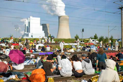 Numerous environmental activists block the tracks of the coal transport railway in Rommerskirchen, Germany, Saturday, June 22, 2019. The protests for more climate protection in the Rhineland continue. Many participants are expected for protests and actions at the Garzweiler opencast mine.
