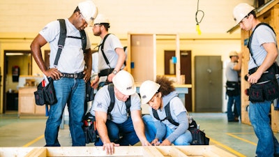 This photo provided by The Home Depot shows students training at the The Home Depot Foundation and HBI's Ft. Stewart Program on a job site in Ft. Stewart, Ga. The Home Depot Foundation announced last year that it was committing $50 million to skilled trades training with plans to attract 20,000 people by 2028.