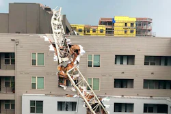 This photo provided by Michael Santana shows the scene after a crane collapsed into Elan City Lights apartments in Dallas amid severe thunderstorms Sunday, June 9, 2019.