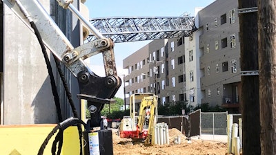This photo provided by Scott Flodin shows a crane that fell on an apartment building amid severe thunderstorms, Sunday, June 9, 2019, in Dallas. The crane fell after the National Weather Service issued a severe thunderstorm watch for the greater Dallas/Fort Worth area.